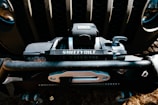 A close-up of a high-quality winch mounted on a truck.