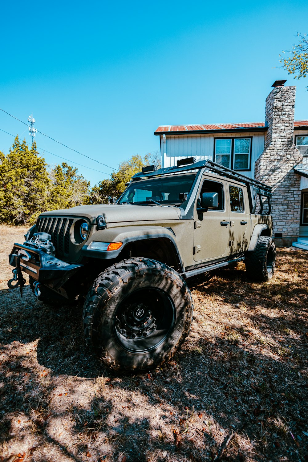 a jeep is parked in front of a house