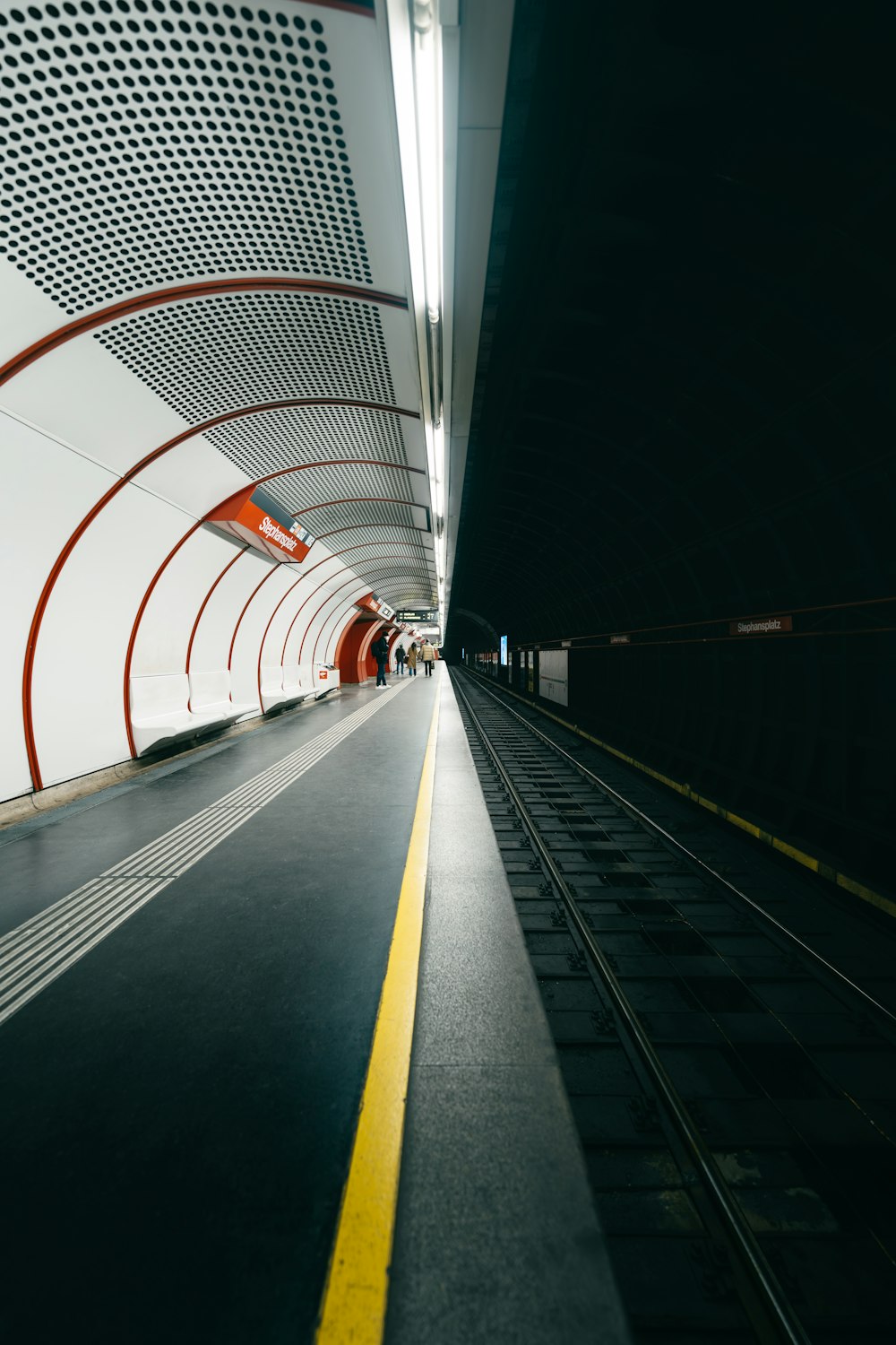 a tunnel with a yellow line going through it