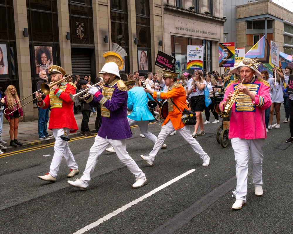 a group of people marching down a street