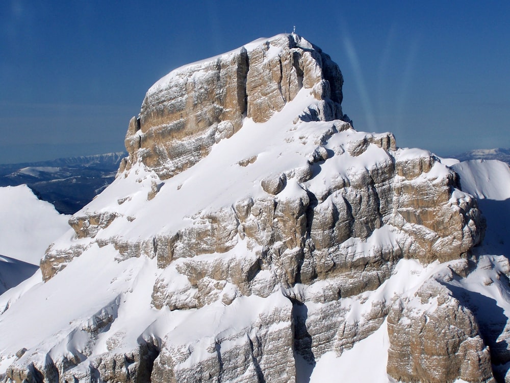 a snow covered mountain with a sky background