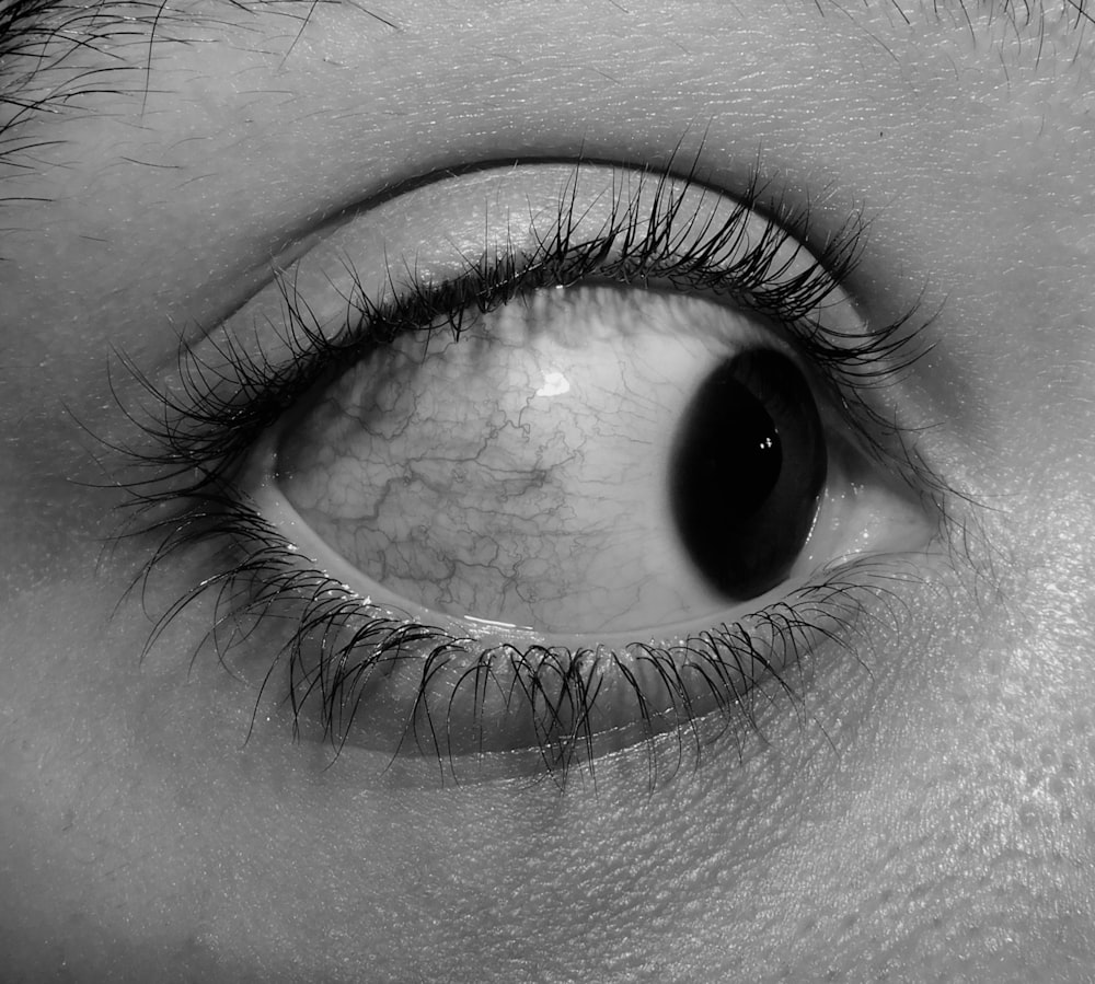 a black and white photo of a person's eye