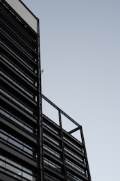 A sleek, modern building exterior showcasing sharp lines and natural materials.