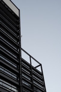 A sleek, modern building exterior showcasing sharp lines and natural materials.