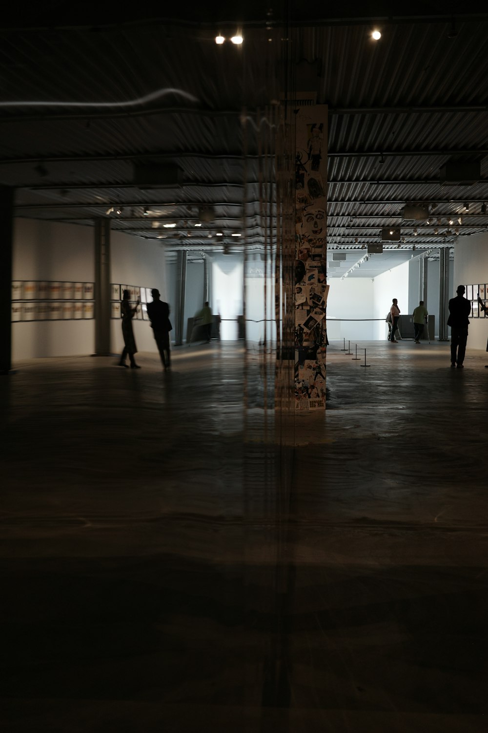 a group of people standing in a large room