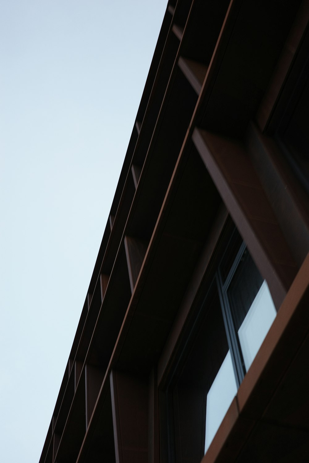 a close up of a building with a sky in the background