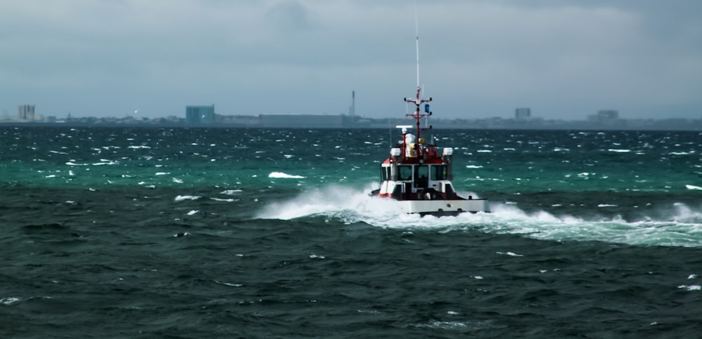 a small boat in the middle of a large body of water