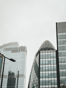 A minimalist London cityscape emphasizing residential buildings under calm skies.