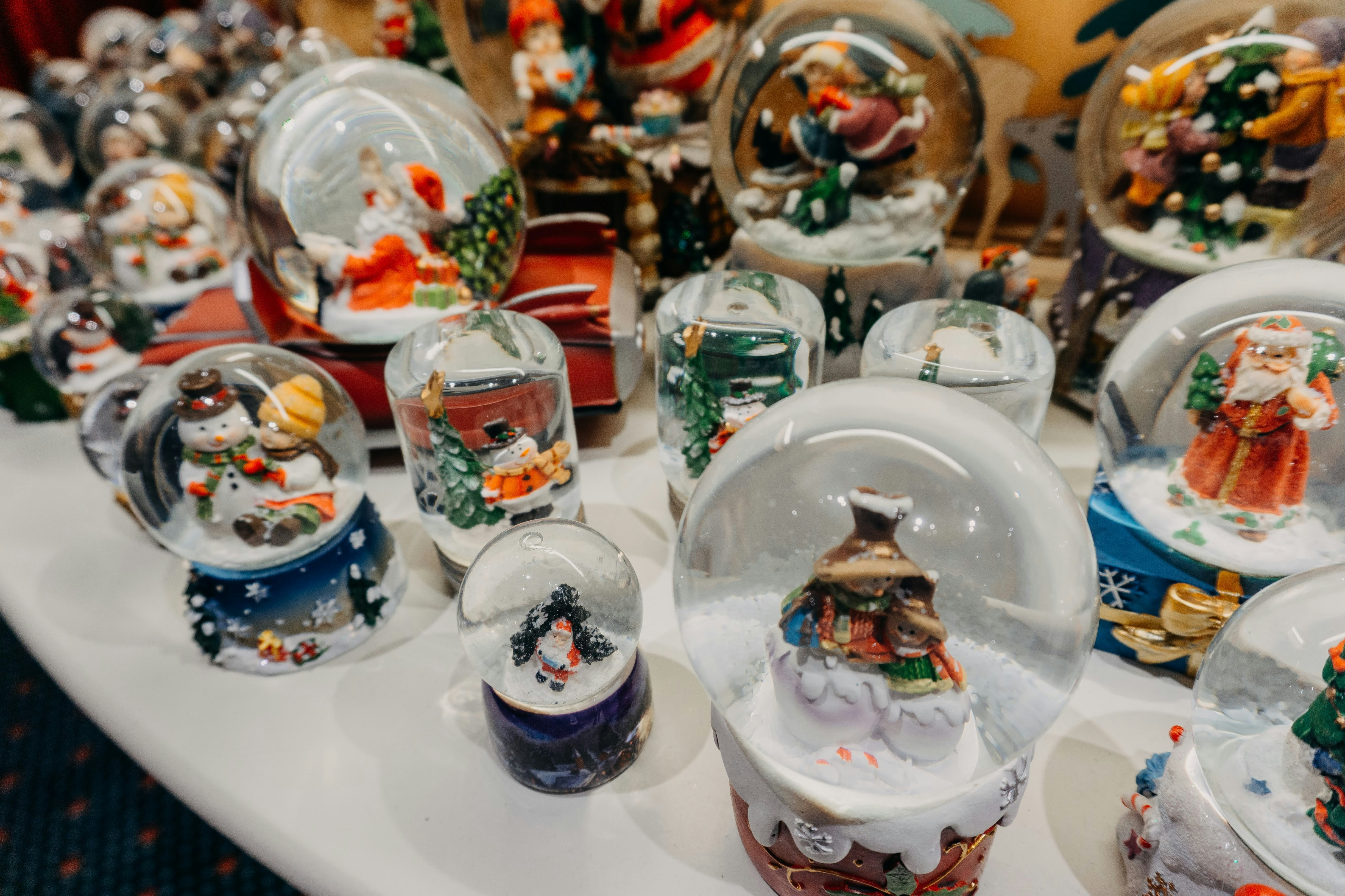 a white table topped with lots of glass dishes