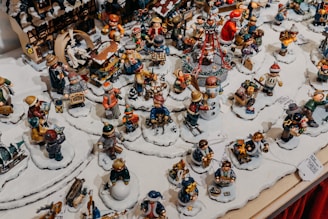 Collection of holiday-themed 3D printed miniatures on display.