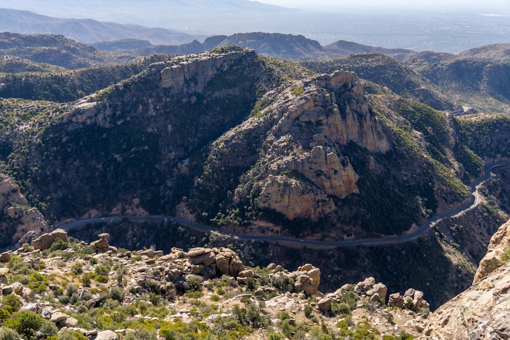 a view of a winding road in the mountains