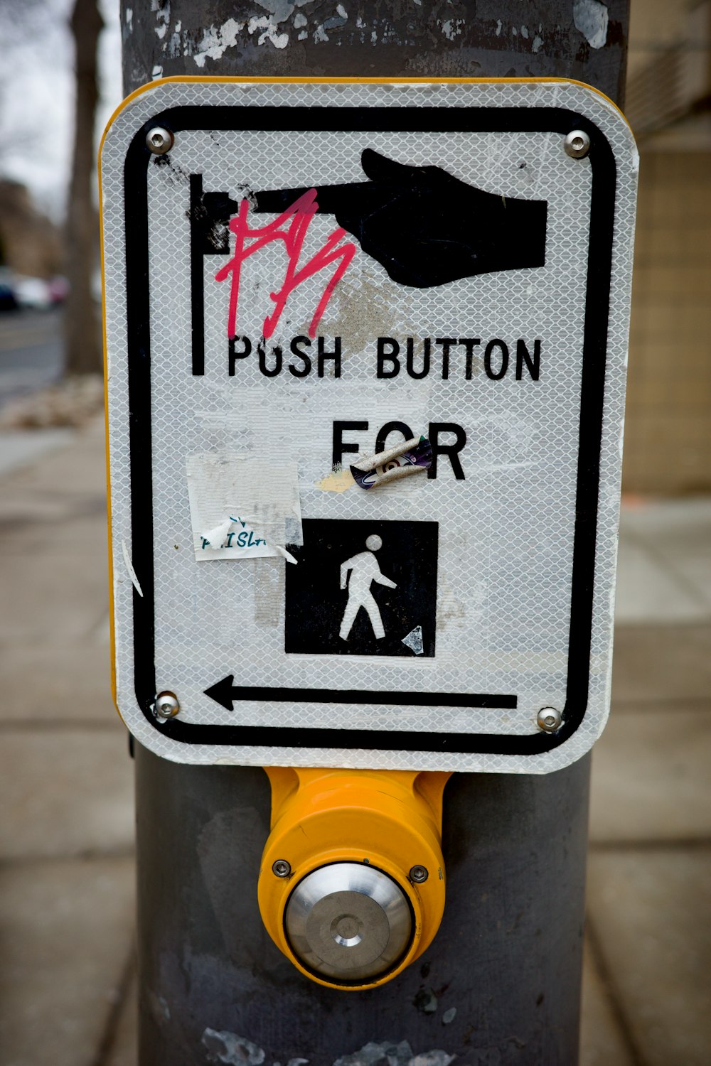 a close up of a street sign on a pole