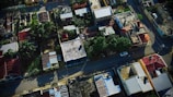 An aerial shot of a residential area with various roof styles.