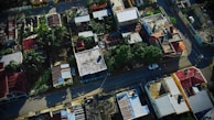 A panoramic view of a residential neighborhood with various roof styles.