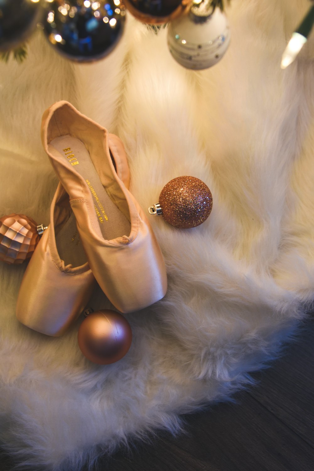 a pair of shoes sitting on top of a fur covered floor