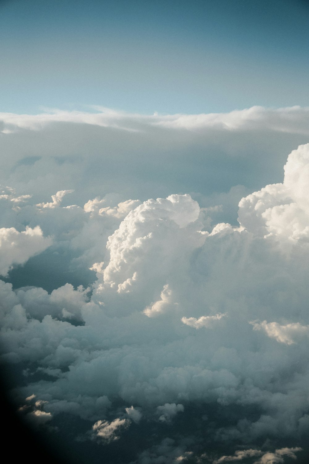 a view of clouds from an airplane window