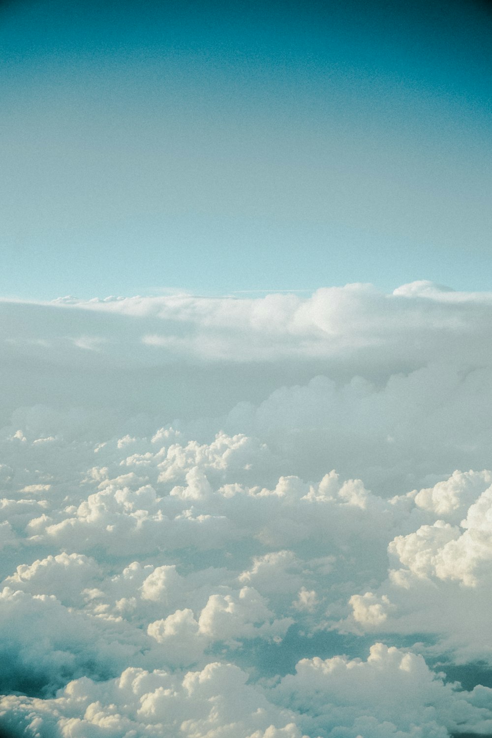 a view of clouds from an airplane window