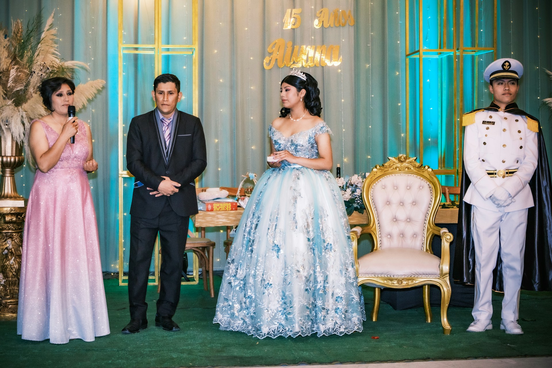 A vibrant quinceañera celebration with a young girl in a stunning dress surrounded by family and friends.