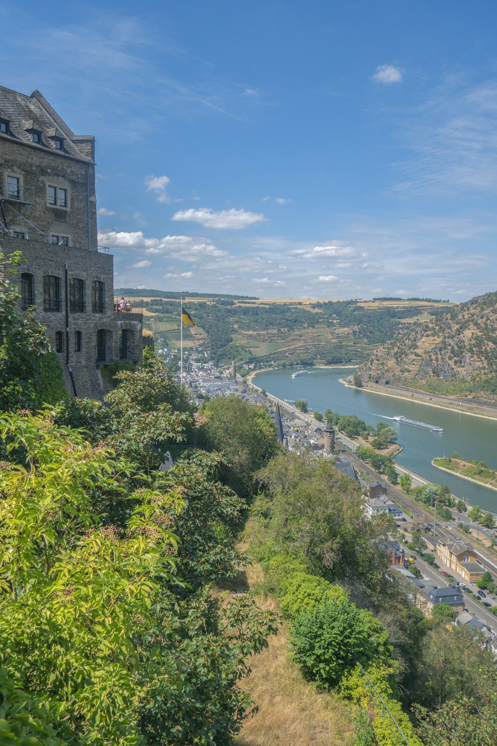 a view of a river and a city from a hill