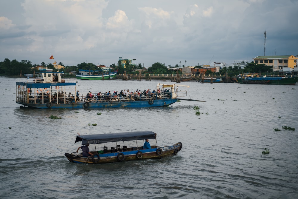 a group of people on a boat in the water