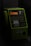 A green public telephone booth with a numeric keypad and a slot for a telephone card. The lighting is dim, giving the telephone a dark and slightly retro appearance. The phone has buttons with numbers, symbols and instructions written in Japanese. An orange display screen can be seen in the middle part, above the keypad. The handset is placed on the left side of the phone.