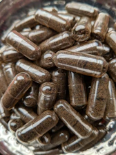a bowl filled with lots of brown pills
