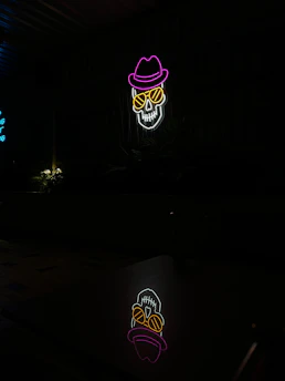 A glowing neon red skull icon on a dark background, symbolizing ethical hacking.