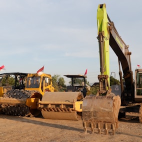 a bulldozer and a bulldozer on a dirt road