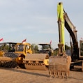 a bulldozer and a bulldozer on a dirt road