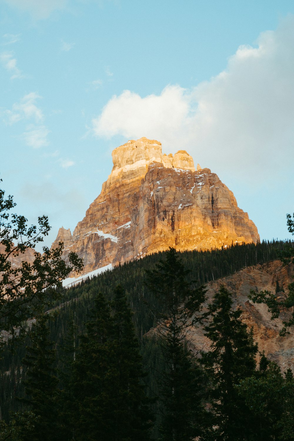 a mountain with a snow capped peak in the distance