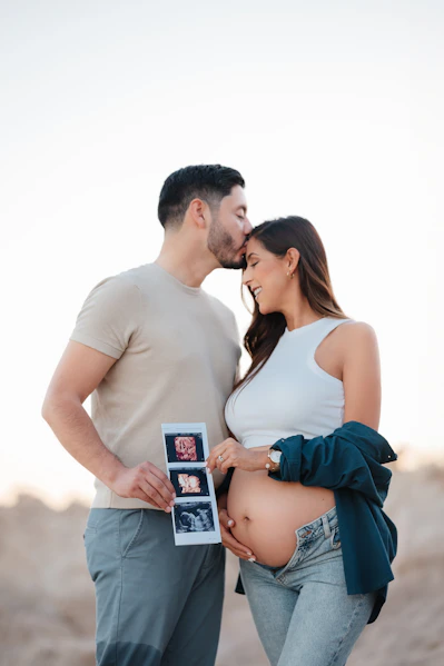 a pregnant couple standing next to each other
