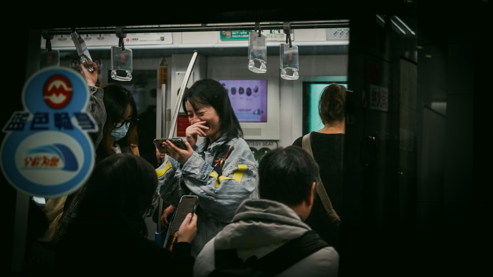 a group of people on a subway train