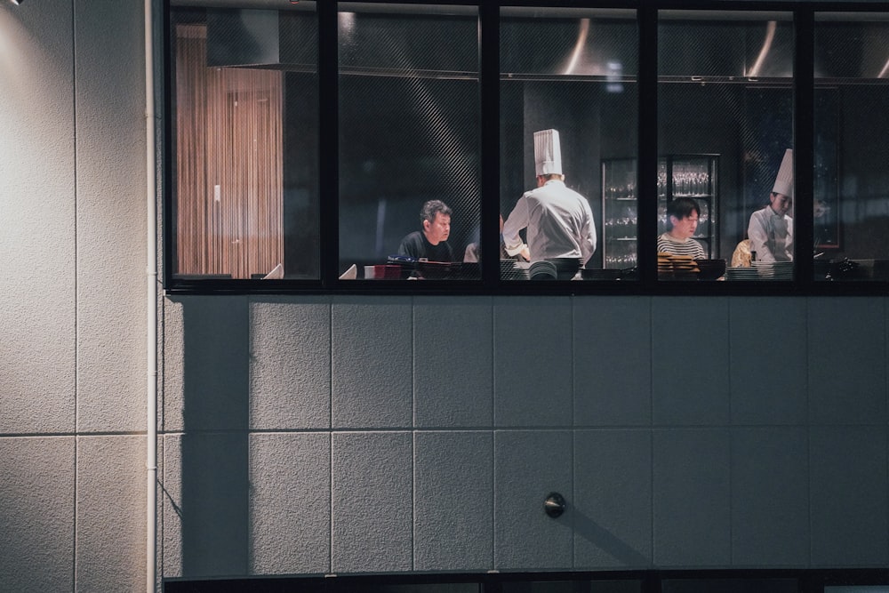a group of chefs working in a kitchen