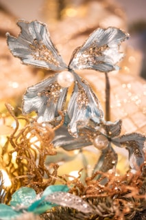 Festive party banner with delicate floral motifs in mocha and pink tones.