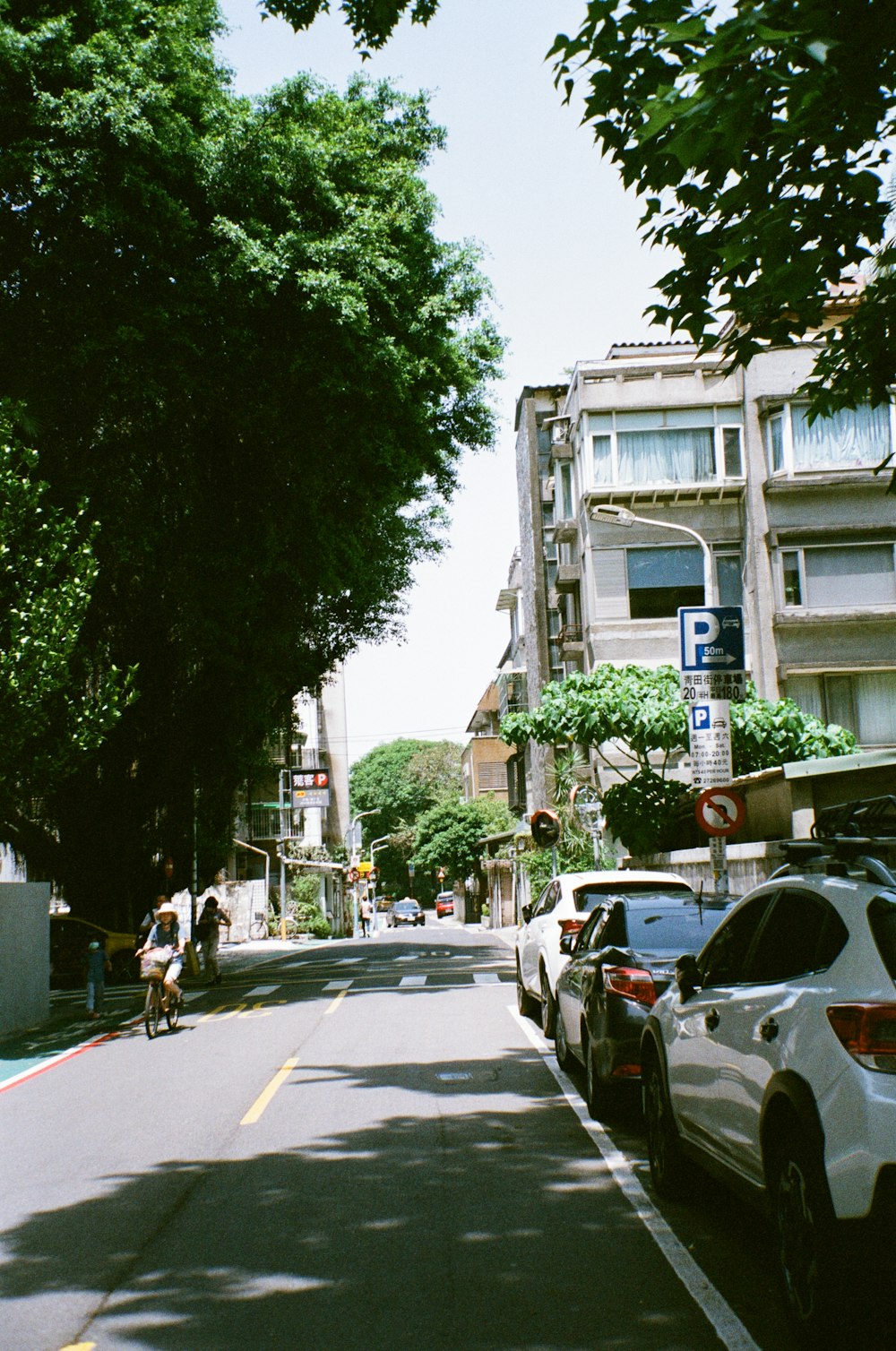 a street with cars parked on both sides of it