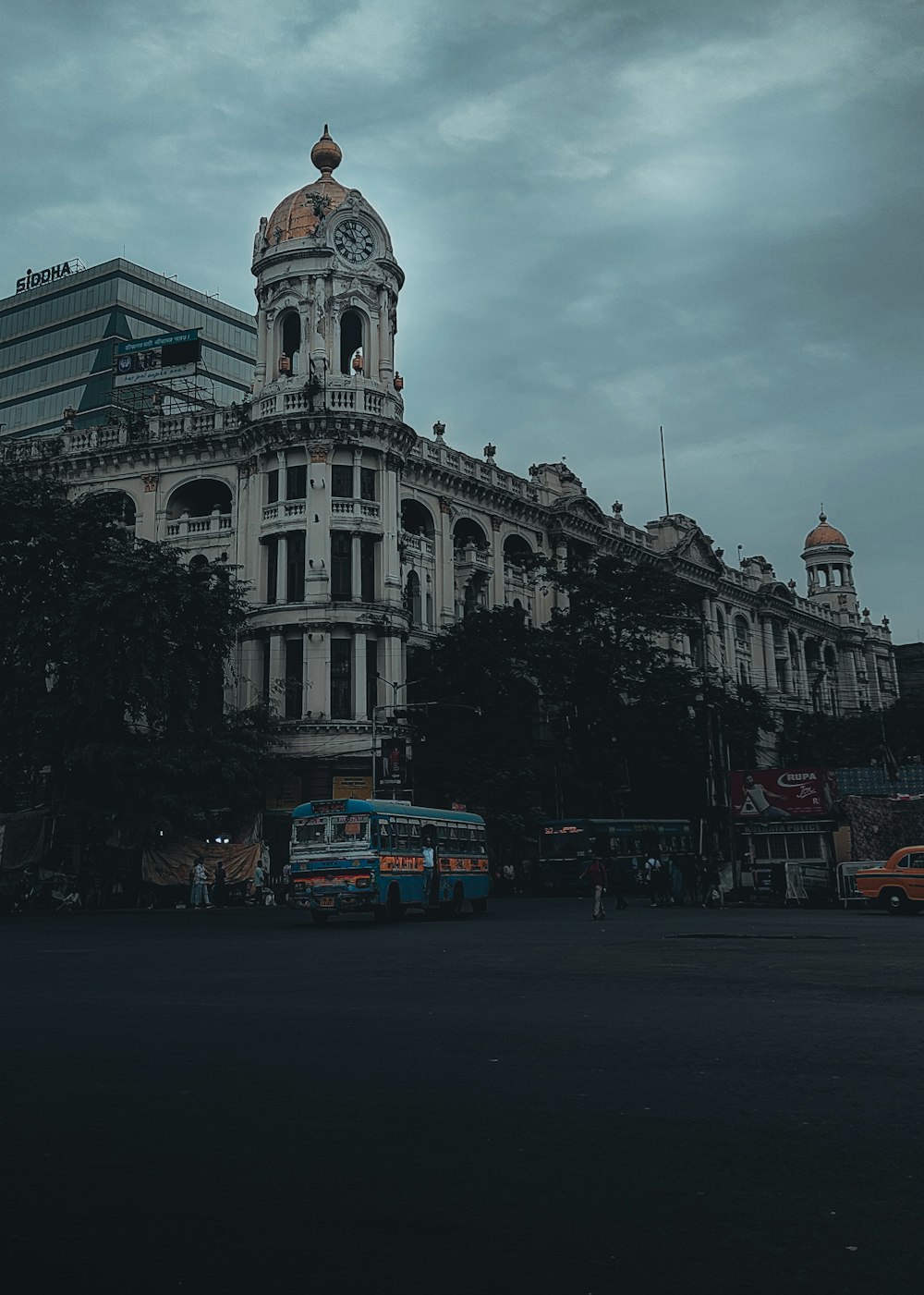 a bus is parked in front of a large building