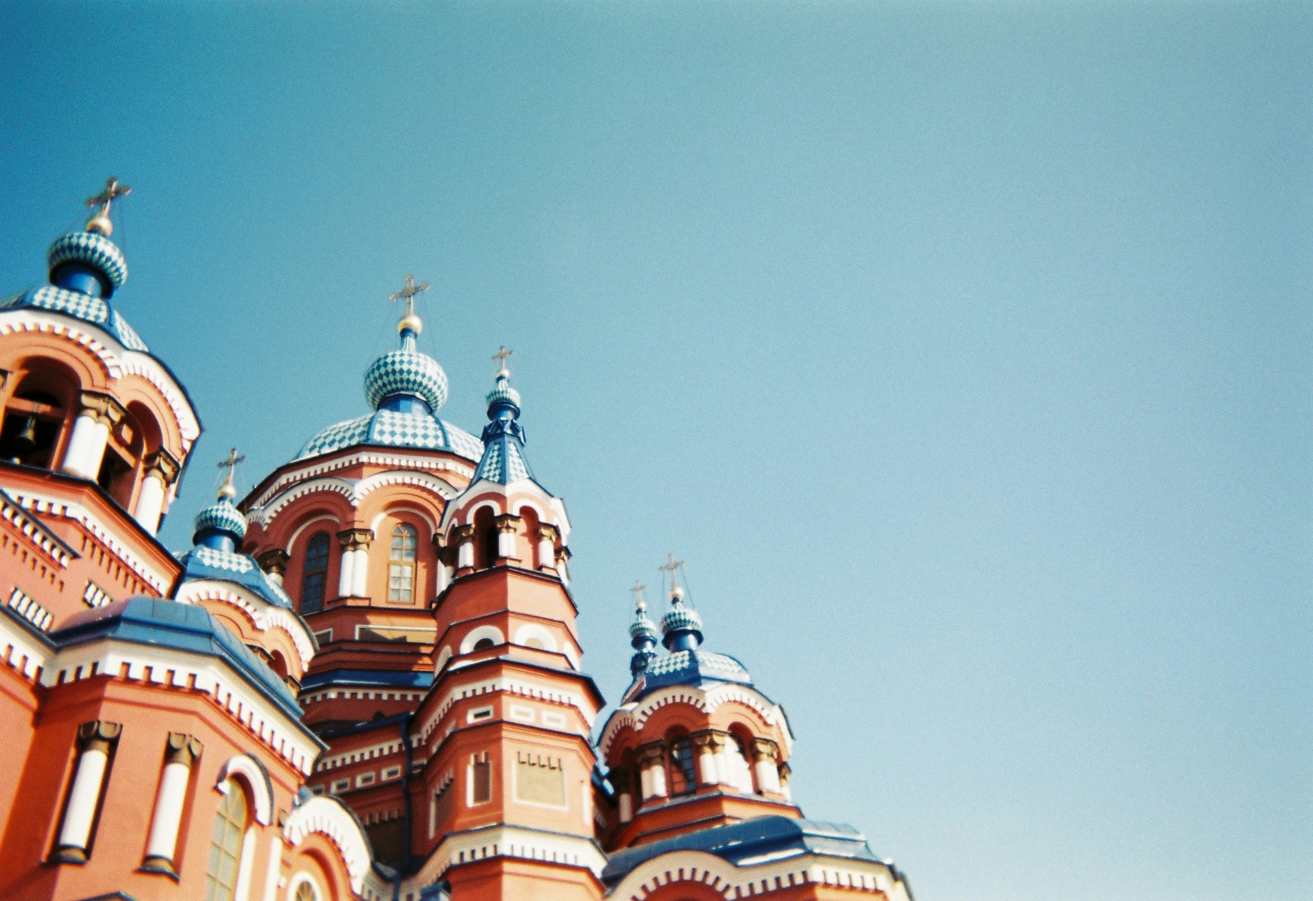 a very tall building with a clock on it's side