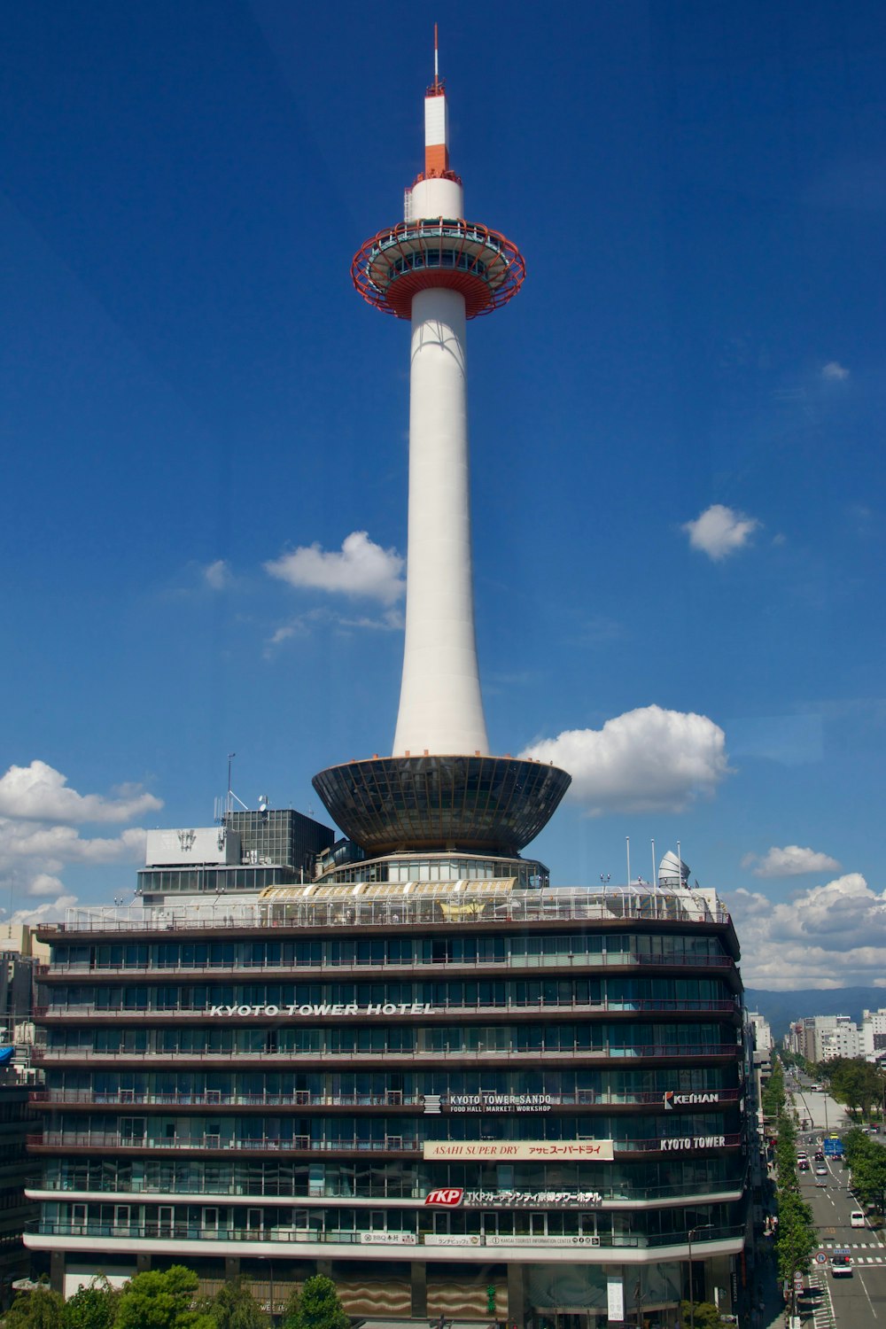 a tall white tower with a red and white top