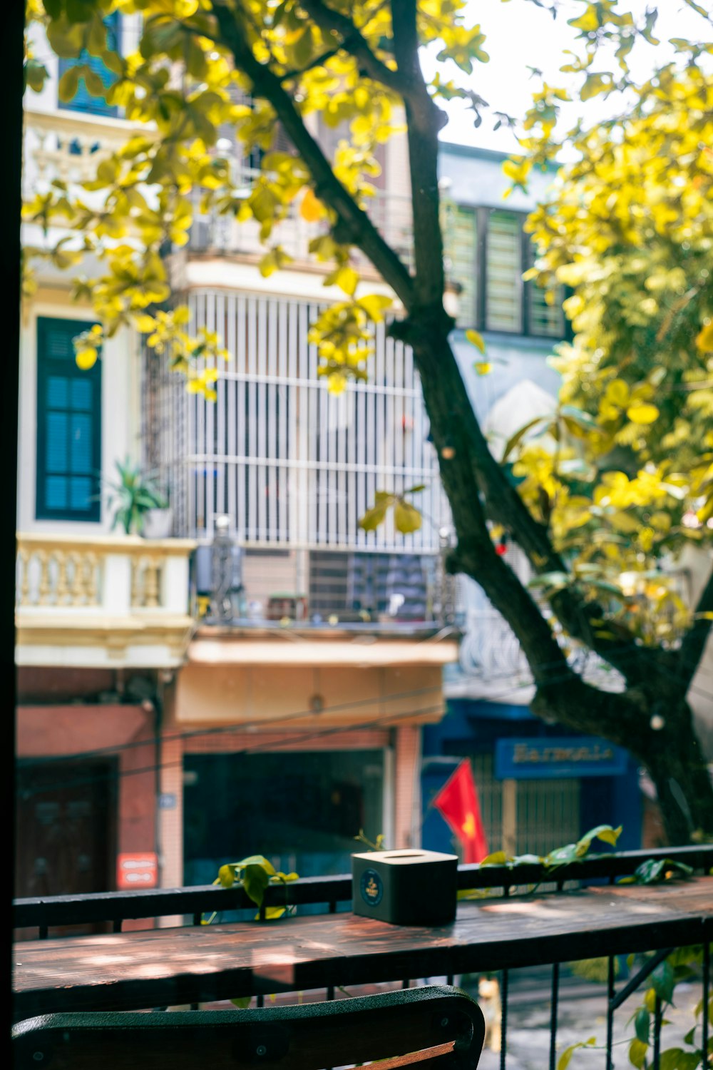 a wooden bench sitting next to a tree