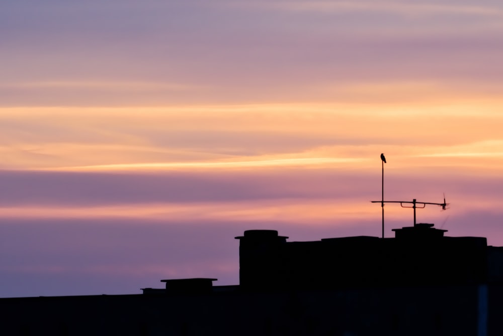 a building with a weather vane on top of it