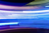 a blurry photo of blue and white lights