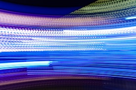 a blurry photo of blue and white lights