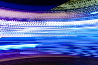 a blurry photo of blue and white lights