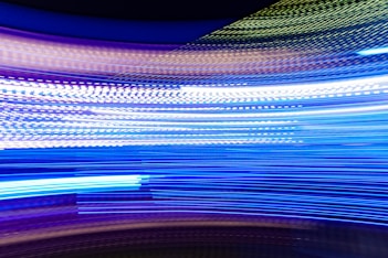 a blurry photo of blue and white lights
