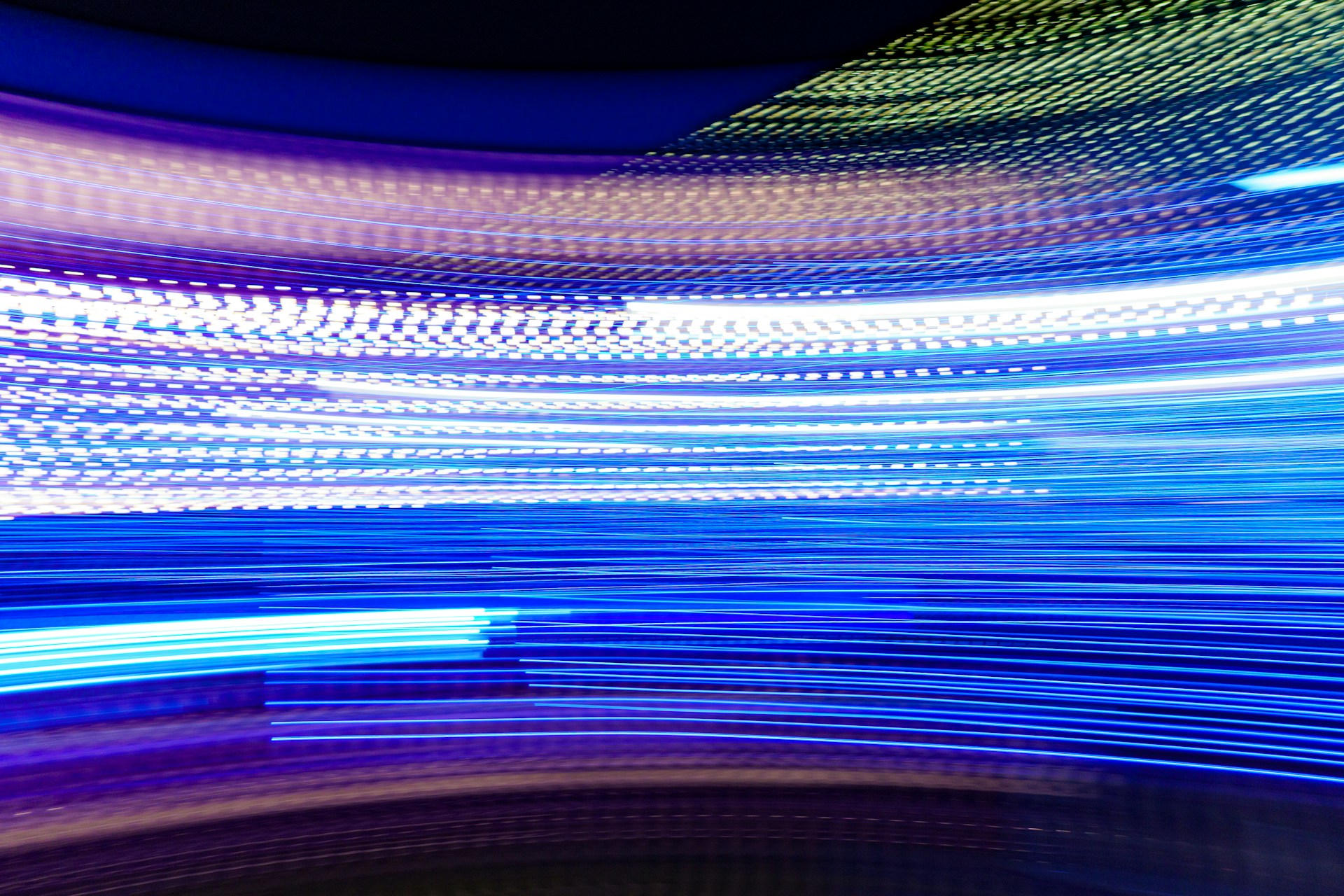 a blurry photo of blue and white lights
