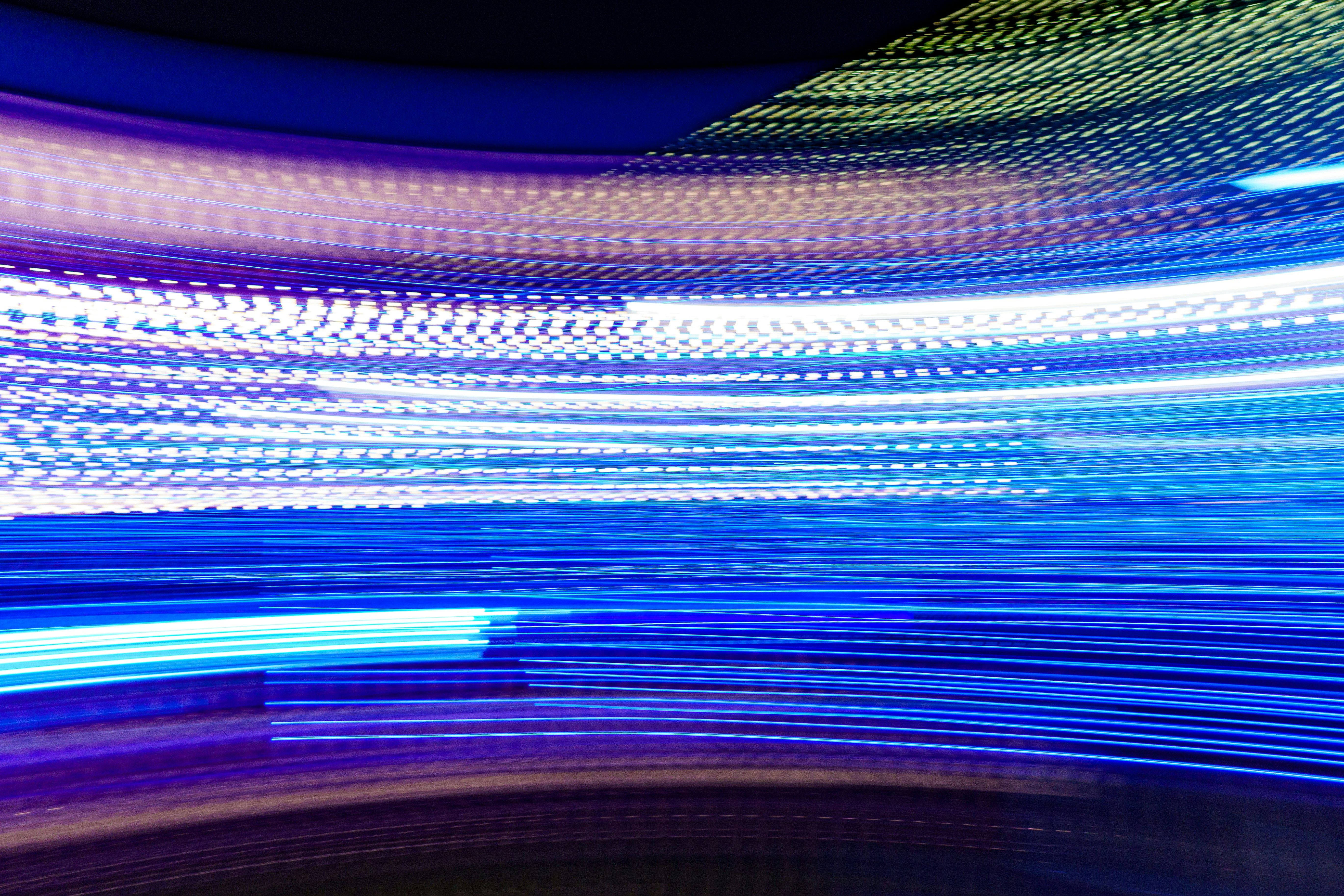 a blurry photo of blue and white lights