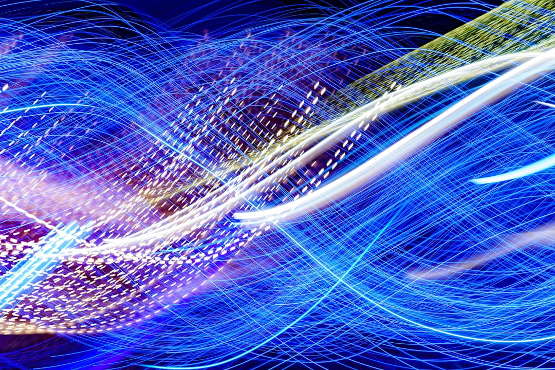 a blurry image of blue and white lights,
