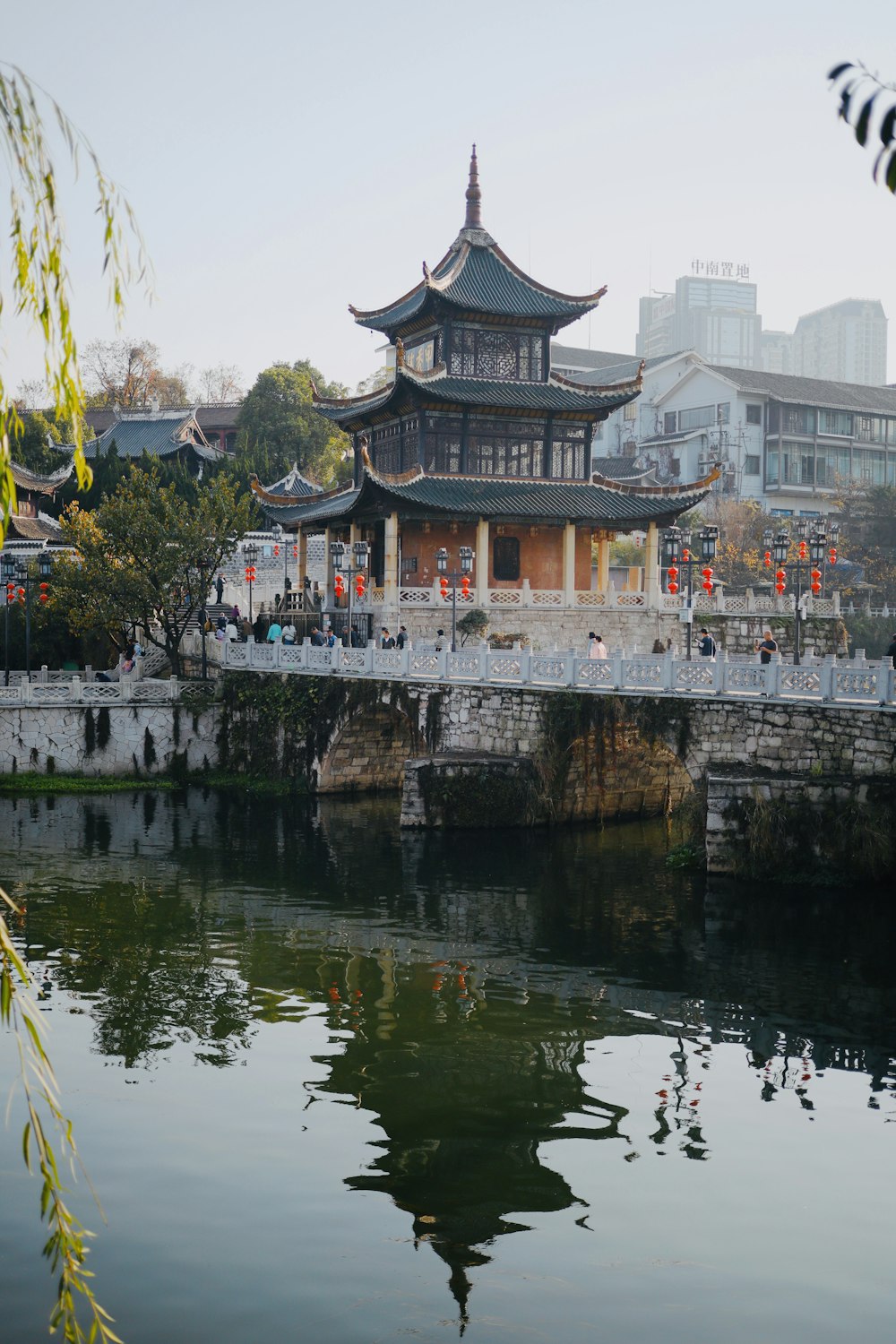 a large building sitting next to a body of water