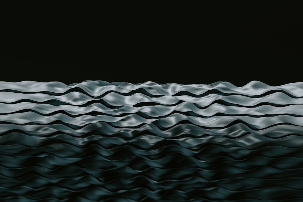 a black and white photo of wavy water