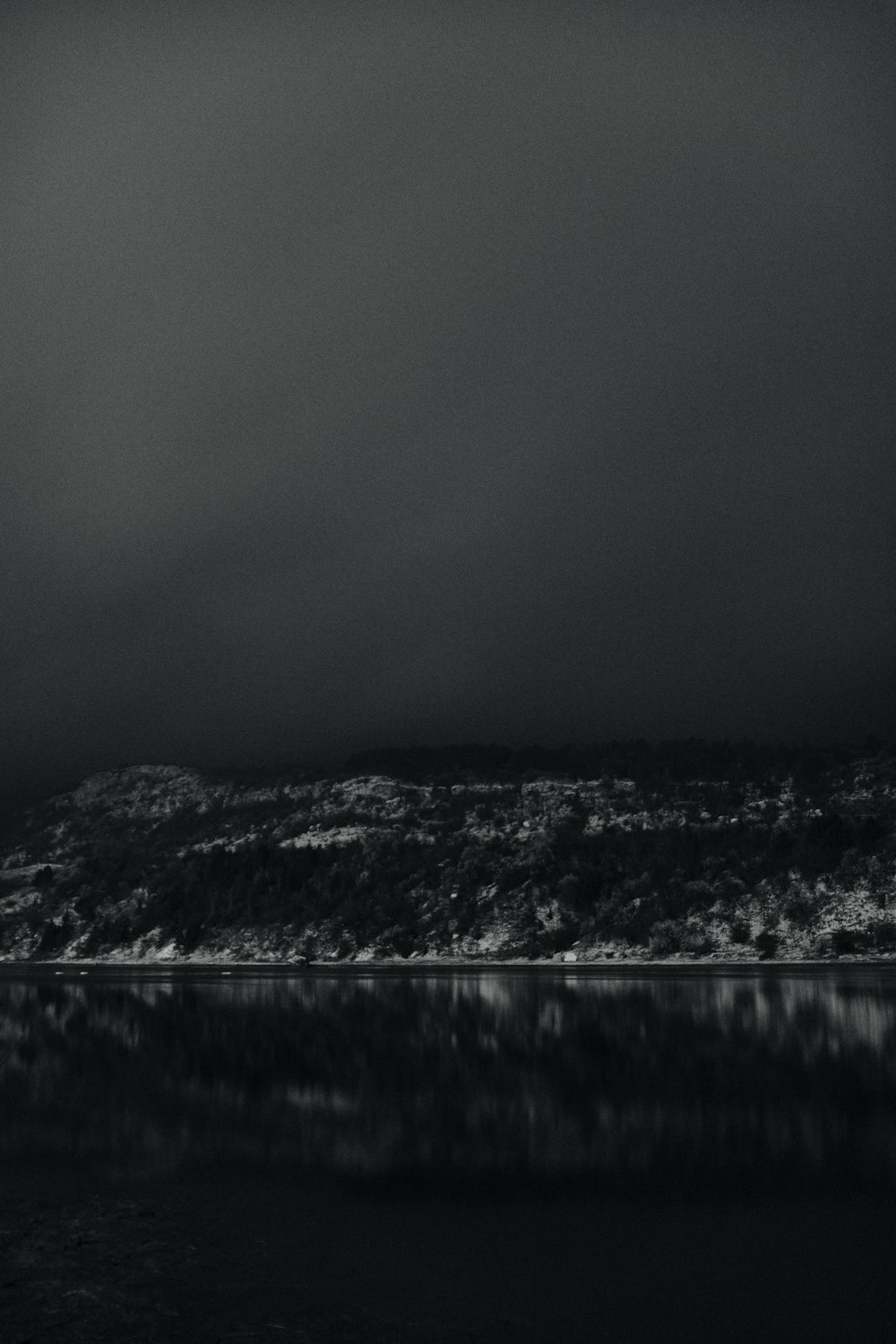 a black and white photo of a body of water